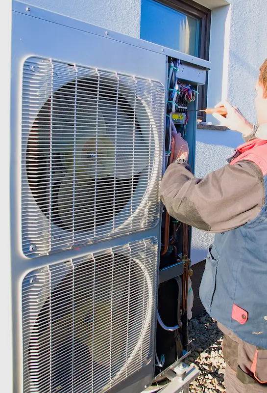Technician repairing an heat pump