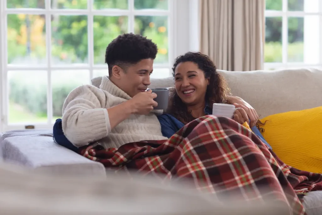 Happy couple enjoying heating