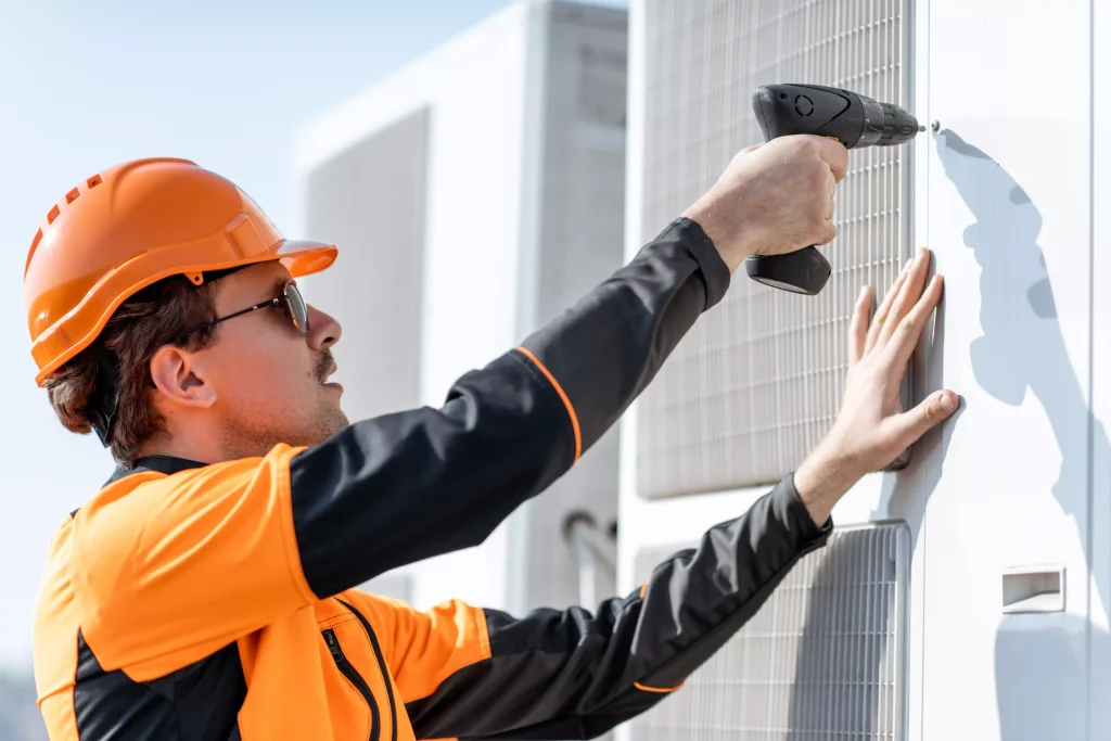 Techinician reparing an commercial ac